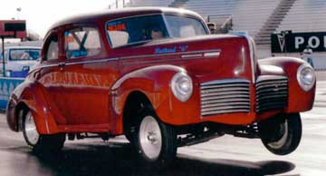 1941 Hudson Coupe doing wheelie at drag strip